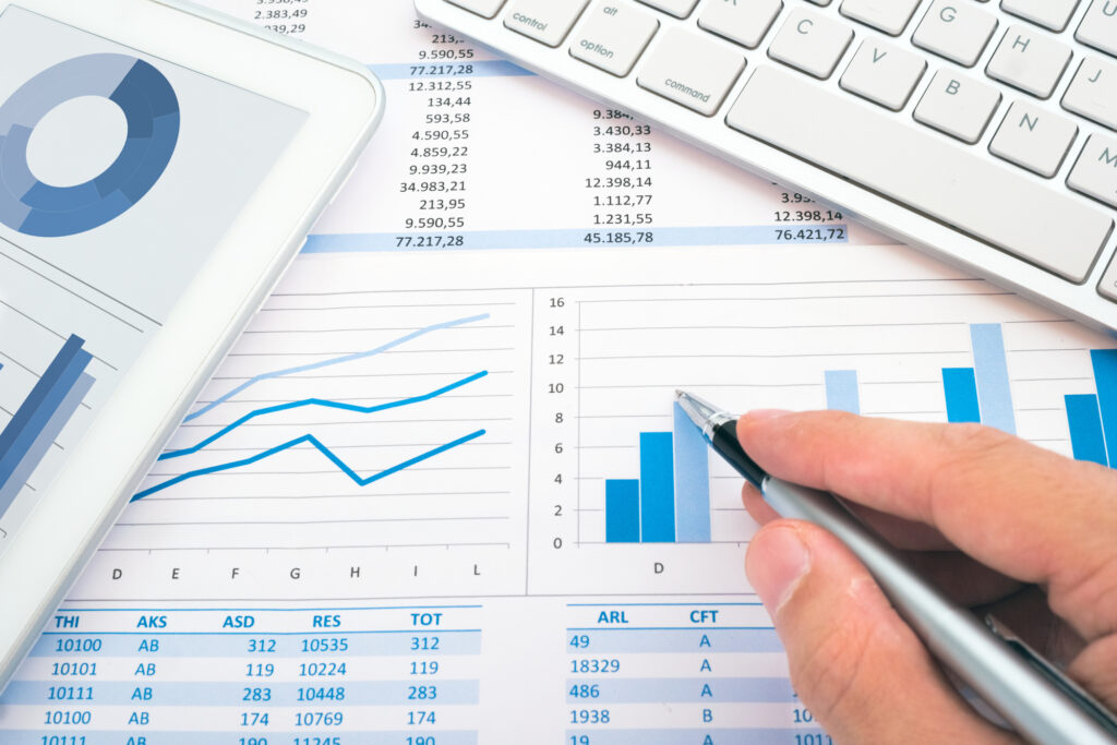 keyboard, pen and financial documents